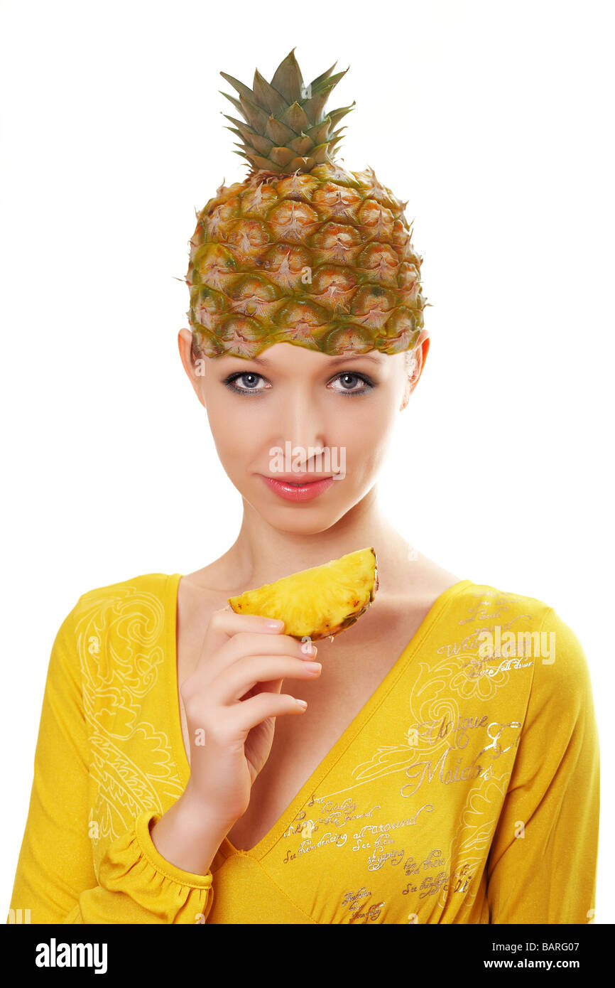 Woman with pineapple on her head hires stock photography and images