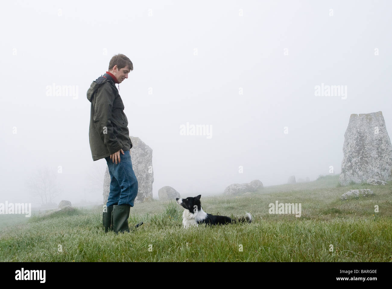 a man with his obidient dog Stock Photo