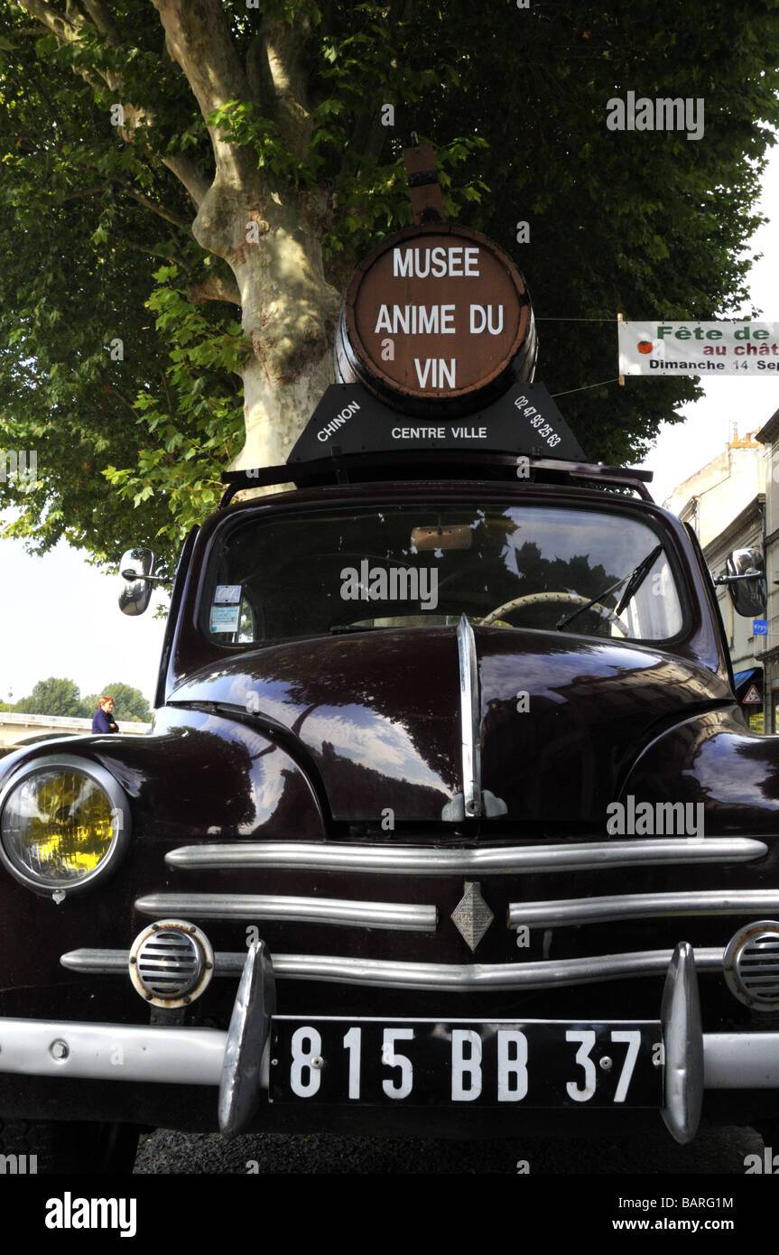 A wooden barrel on an old Renault 4CV car is used to advertise the wine museum in Chinon Indre-et-Loire France Stock Photo