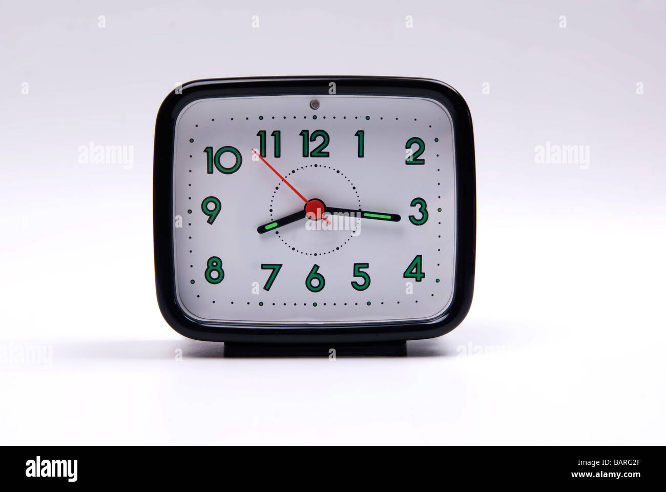 Alarm clock against a white background Stock Photo