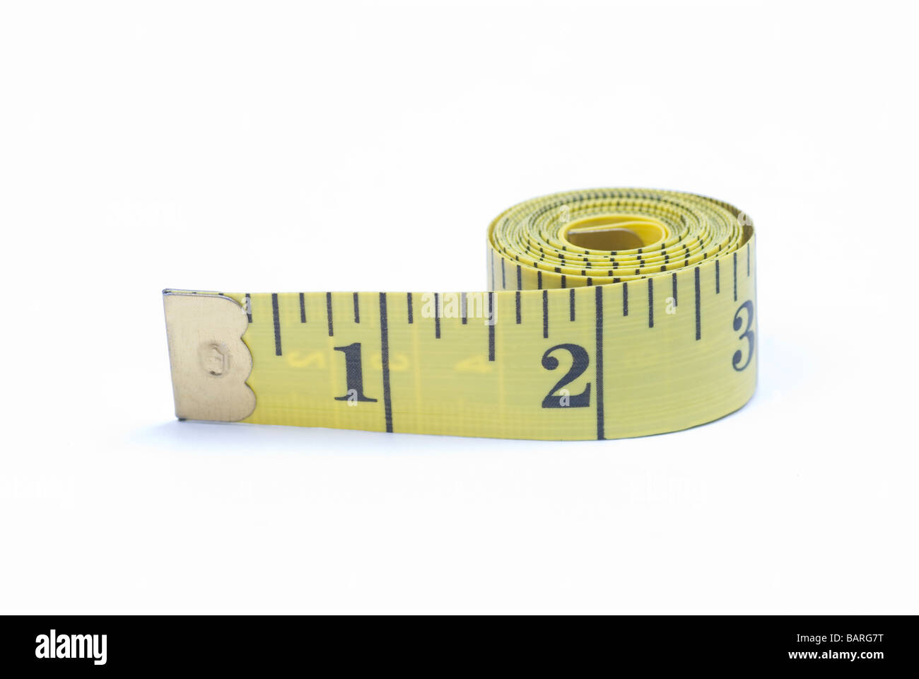 Tailors tape measure cut out against a white background. Yellow measuring  tape Stock Photo - Alamy