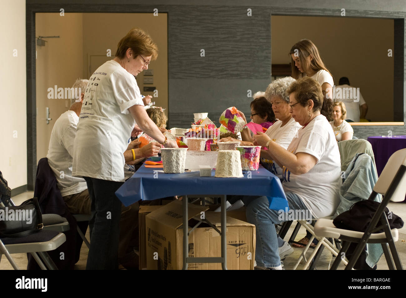 A group of volunteers color pots for the University Synagogue, Big