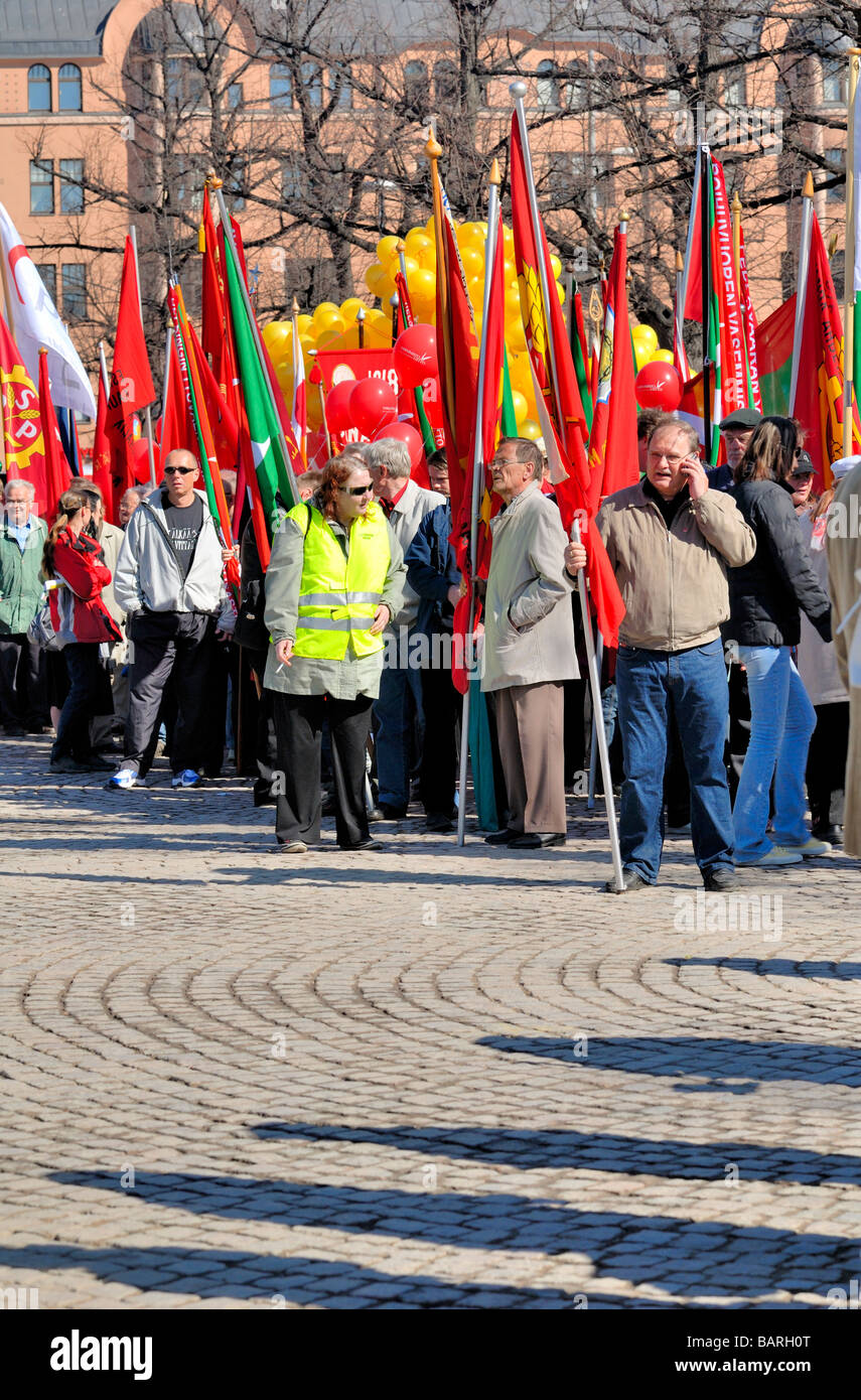 The Finnish labour union, SAK, May Day parade with the red union flags is going to start from the Railwaystation square. Helsink Stock Photo