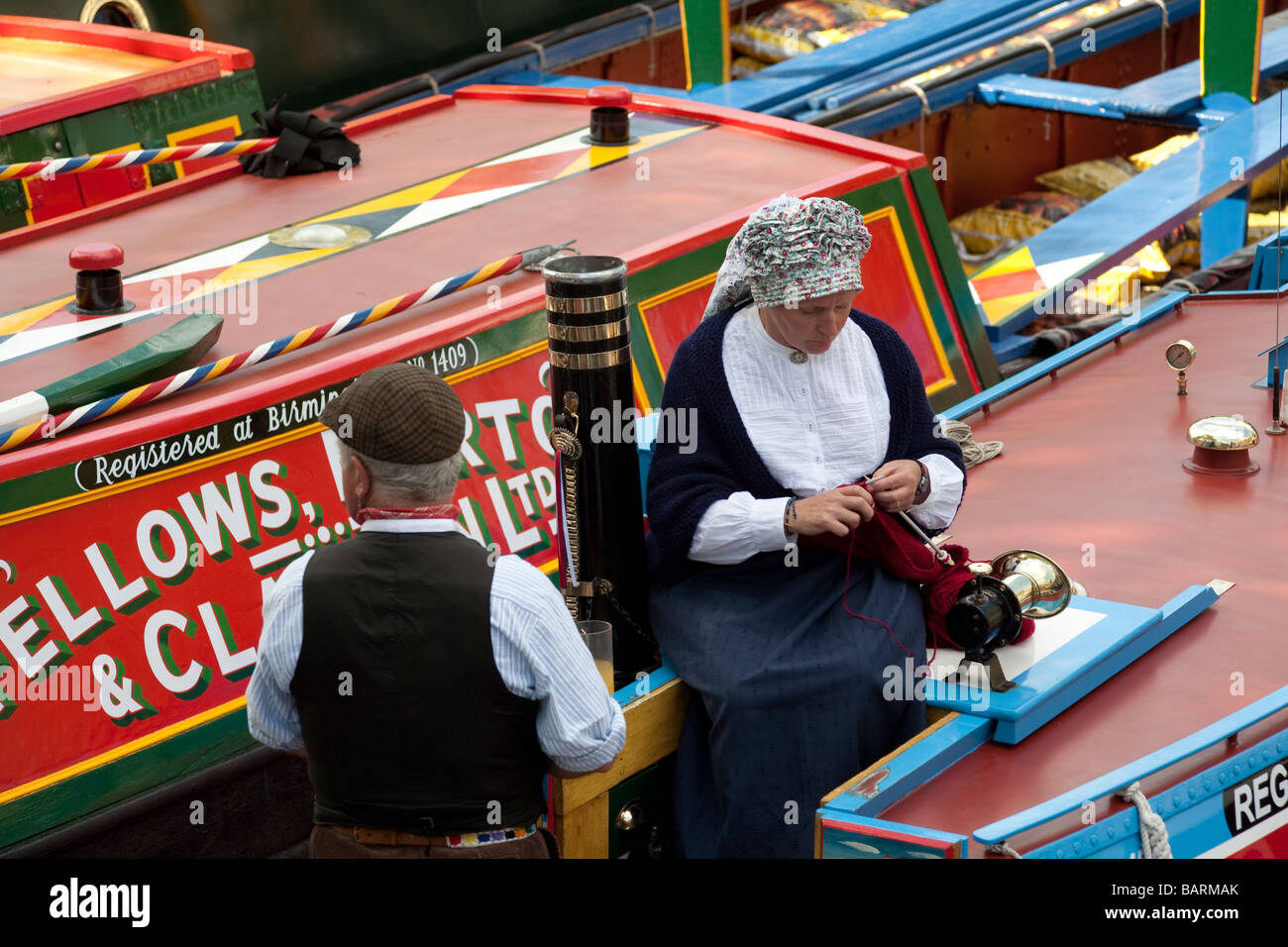Narrow boat couple in traditional costume. Canal Cavalcade Festival, Little Venice, London, England, UK Stock Photo