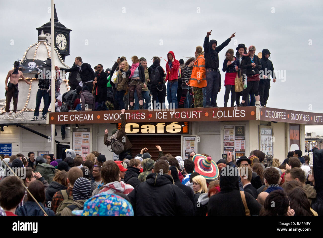 Group of people dancing on cafe roof at may day protests in Brighton, Sussex, UK JPH0202 Stock Photo