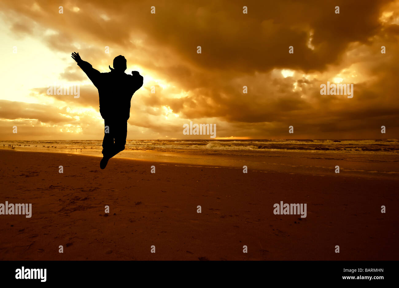 Jump For Joy On The Beach With Sunset Stock Photo Alamy