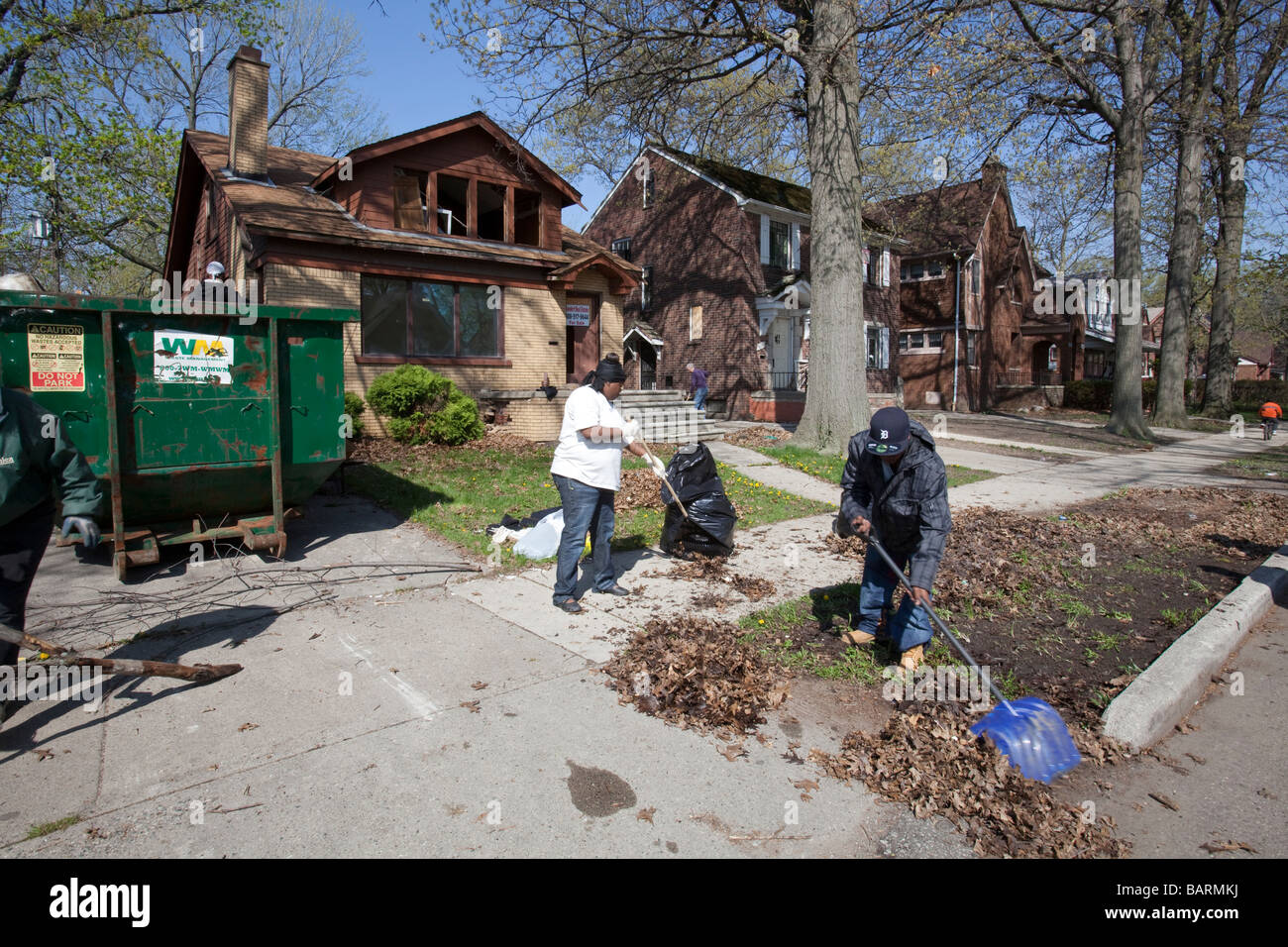 Volunteers clean trash from their neighborhood Stock Photo