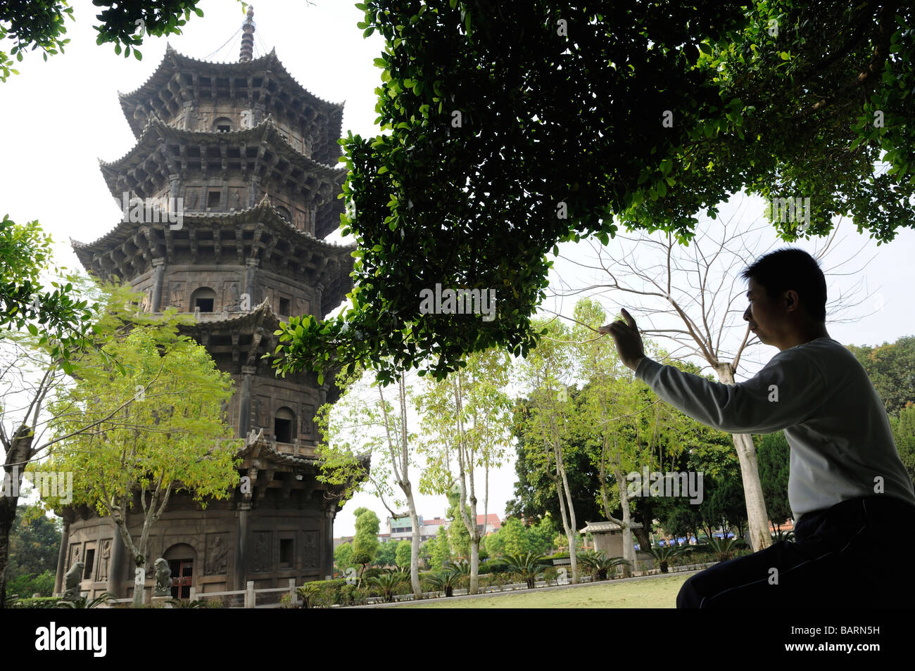Chinese man practicing Taiji in early morning at Kaiyuan Si Temple in Quanzhou, Fujian, China. 14-Apr-2009 Stock Photo