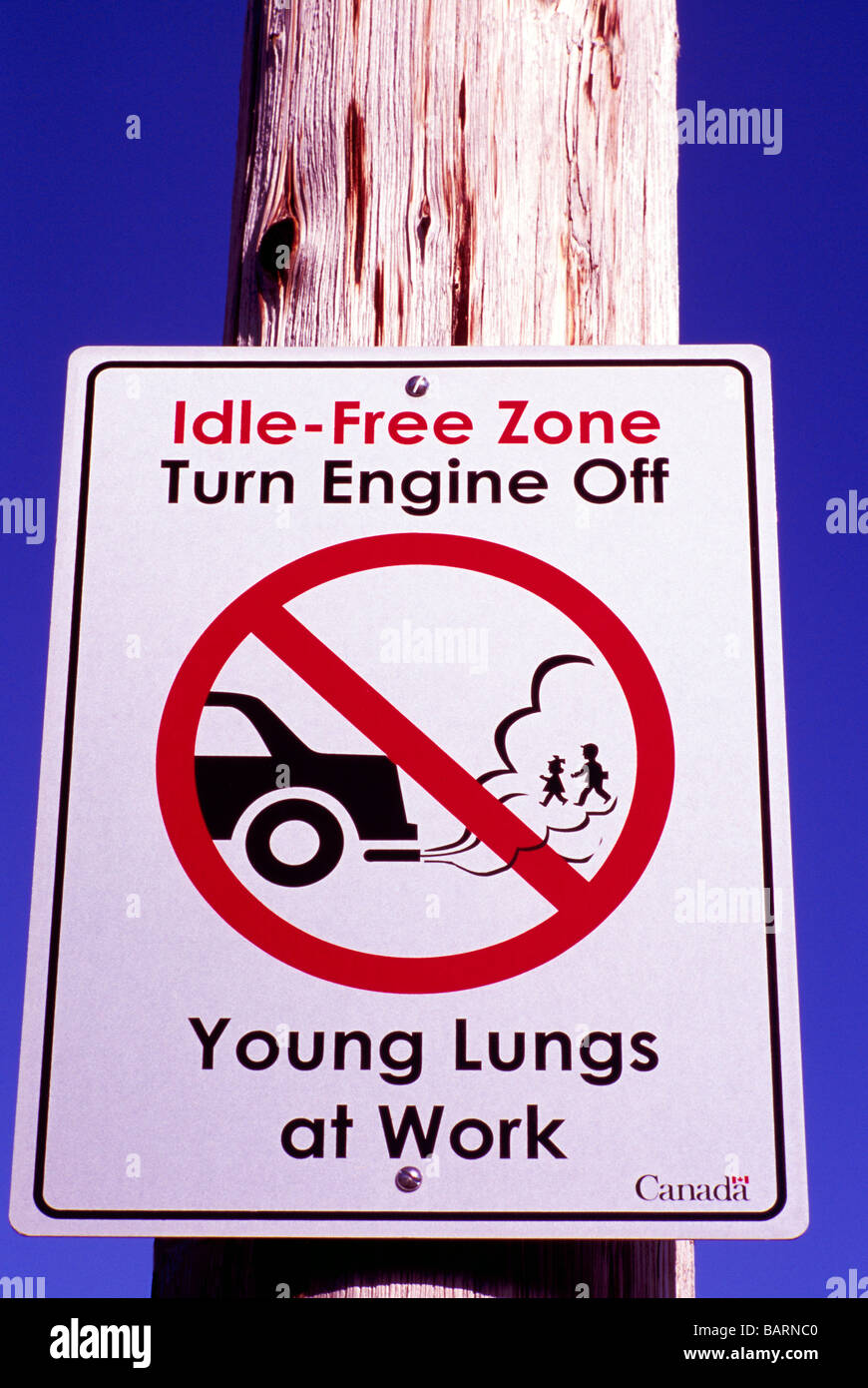 City Bylaw Sign - Idle Free Zone, Turn off Car Engine, No Idling, No Exhaust Fumes, Stop Air Pollution, British Columbia Canada Stock Photo
