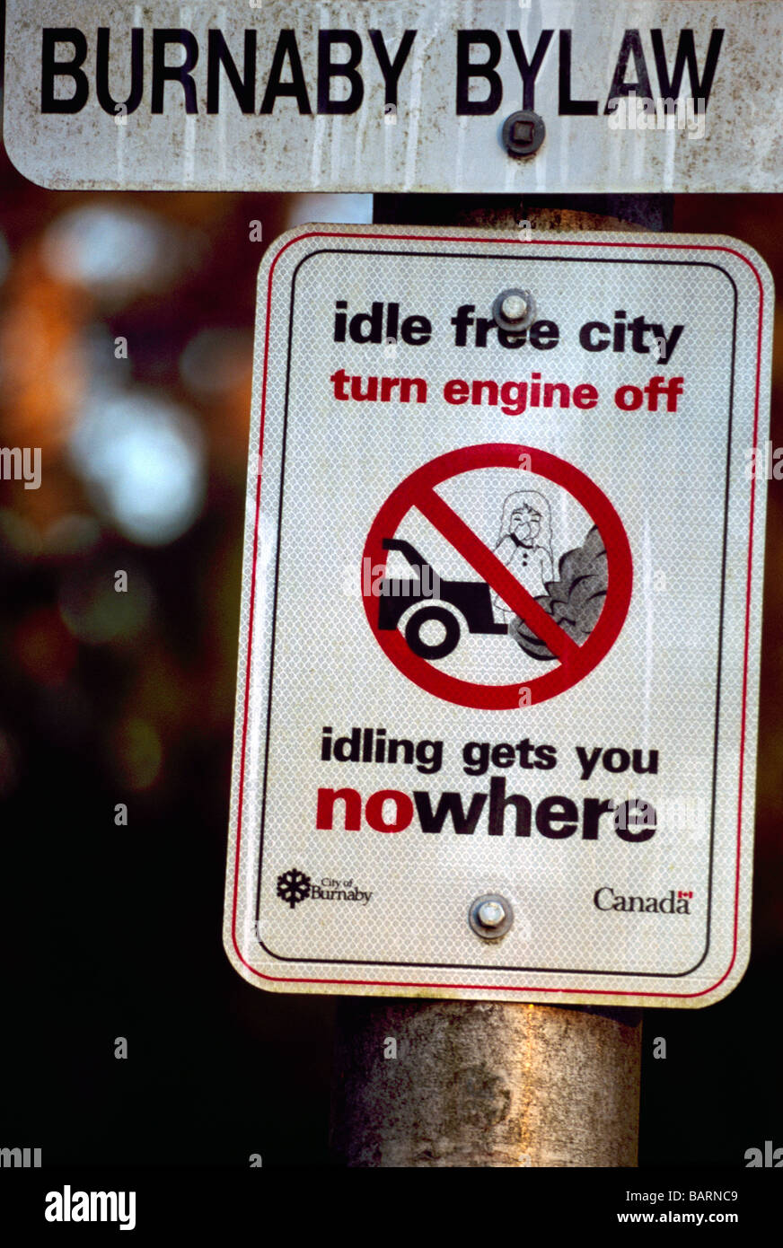 City Bylaw Sign - Idle Free Zone, Turn off Car Engine, No Idling, No Exhaust Fumes, Stop Air Pollution, British Columbia Canada Stock Photo