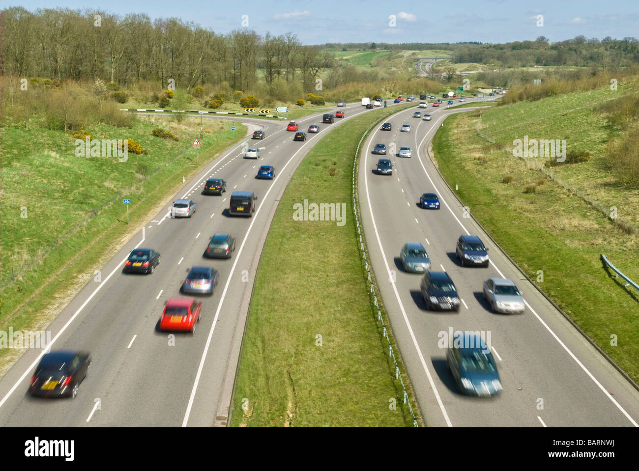 A dual carriage way - the A34 Newbury bypass where it crosses the A4 with passing traffic.  Slow shutter speed for motion blur. Stock Photo