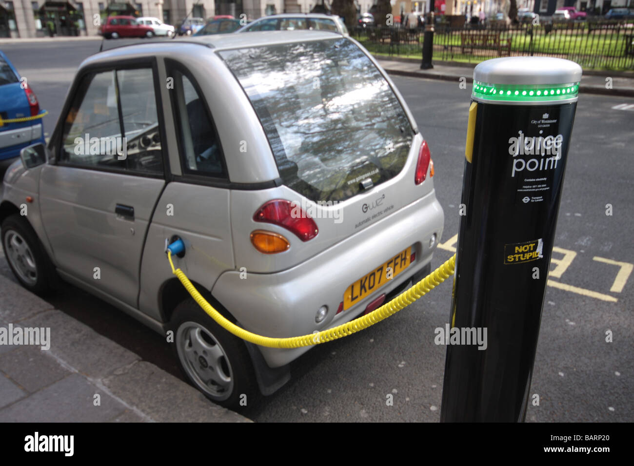 Electric Car Buyers To Be Given Cash Incentives  G-Wiz electric vehicles are parked in charging bays Stock Photo