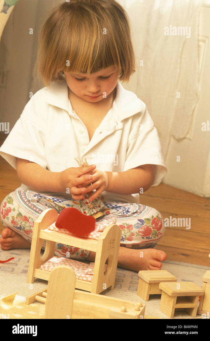 little girl playing with her doll s house Stock Photo - Alamy
