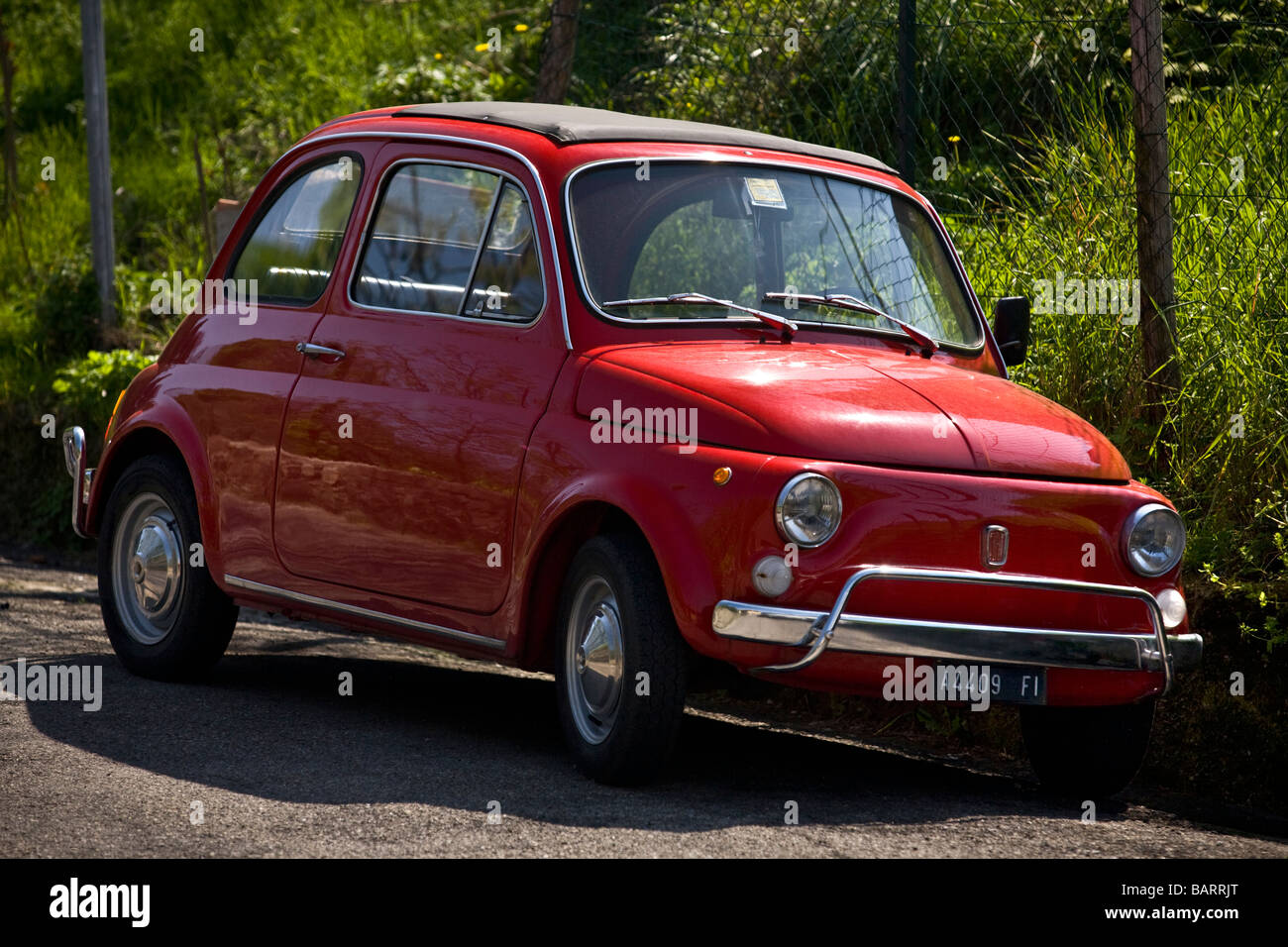 A red original Fiat 500 (Tuscany - Italy). FIAT 500 d'origine rouge (Toscane - Italie). Stock Photo