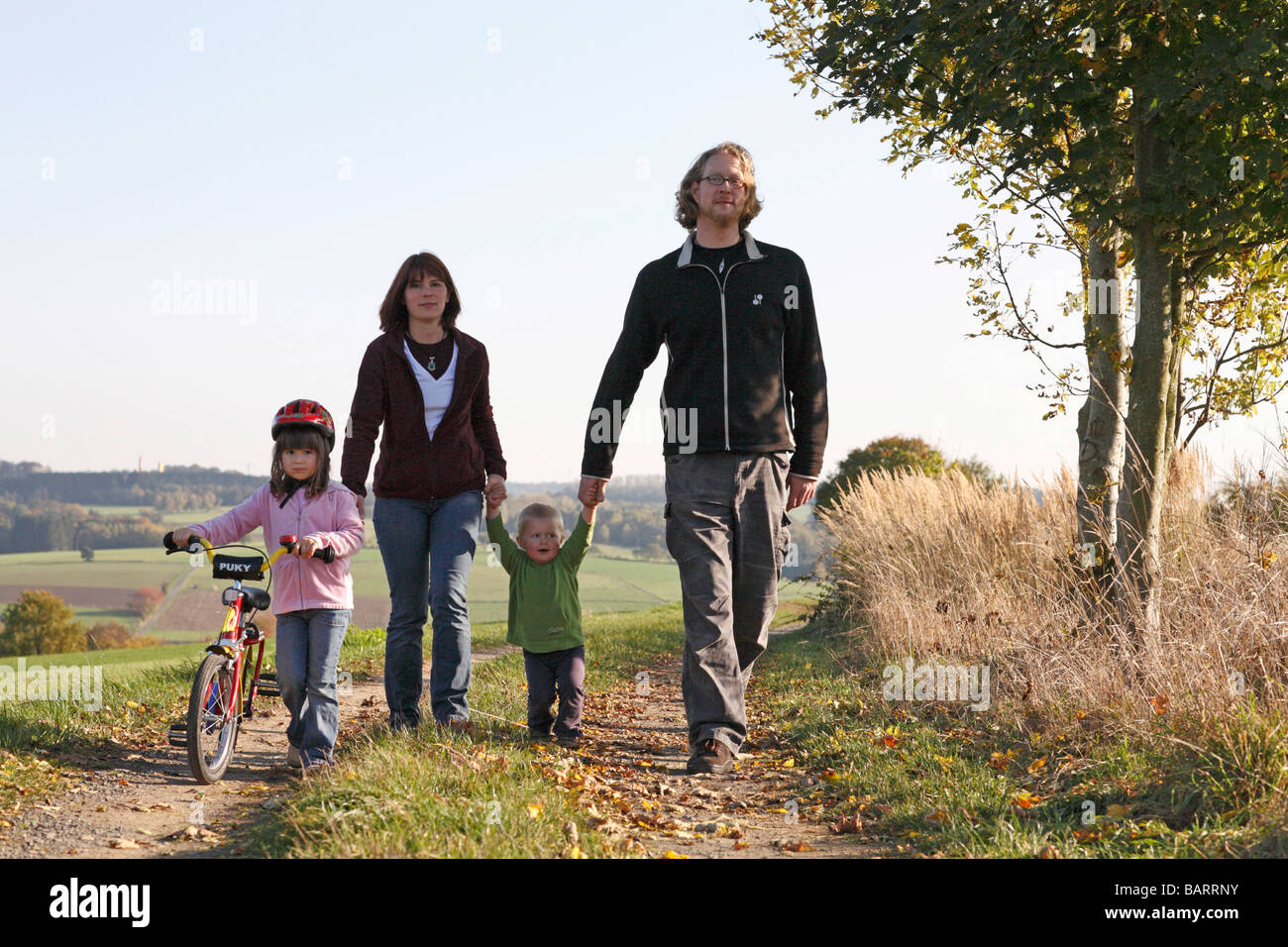 Young family taking a walk Stock Photo