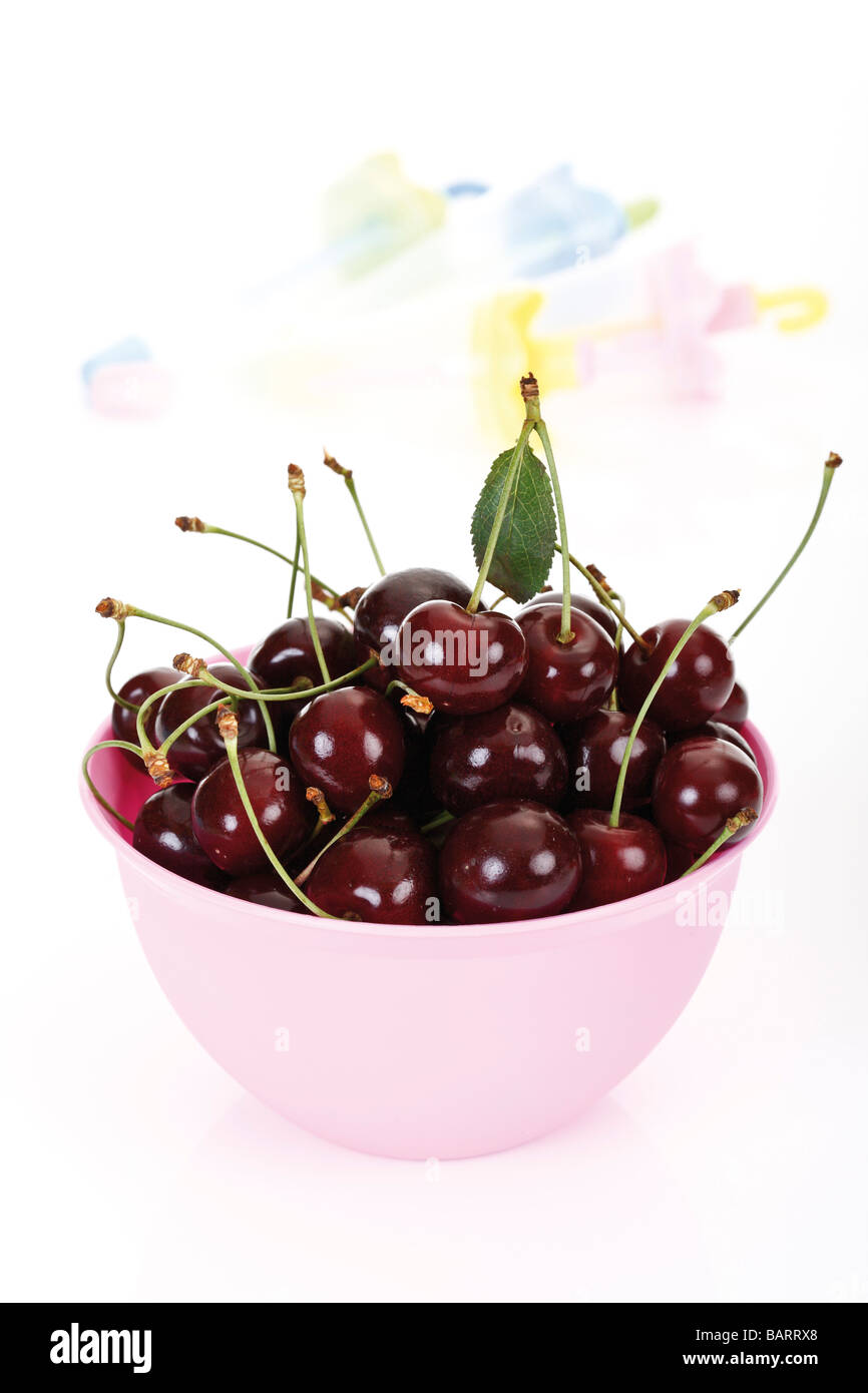 Sour cherries in plastic bowl Stock Photo