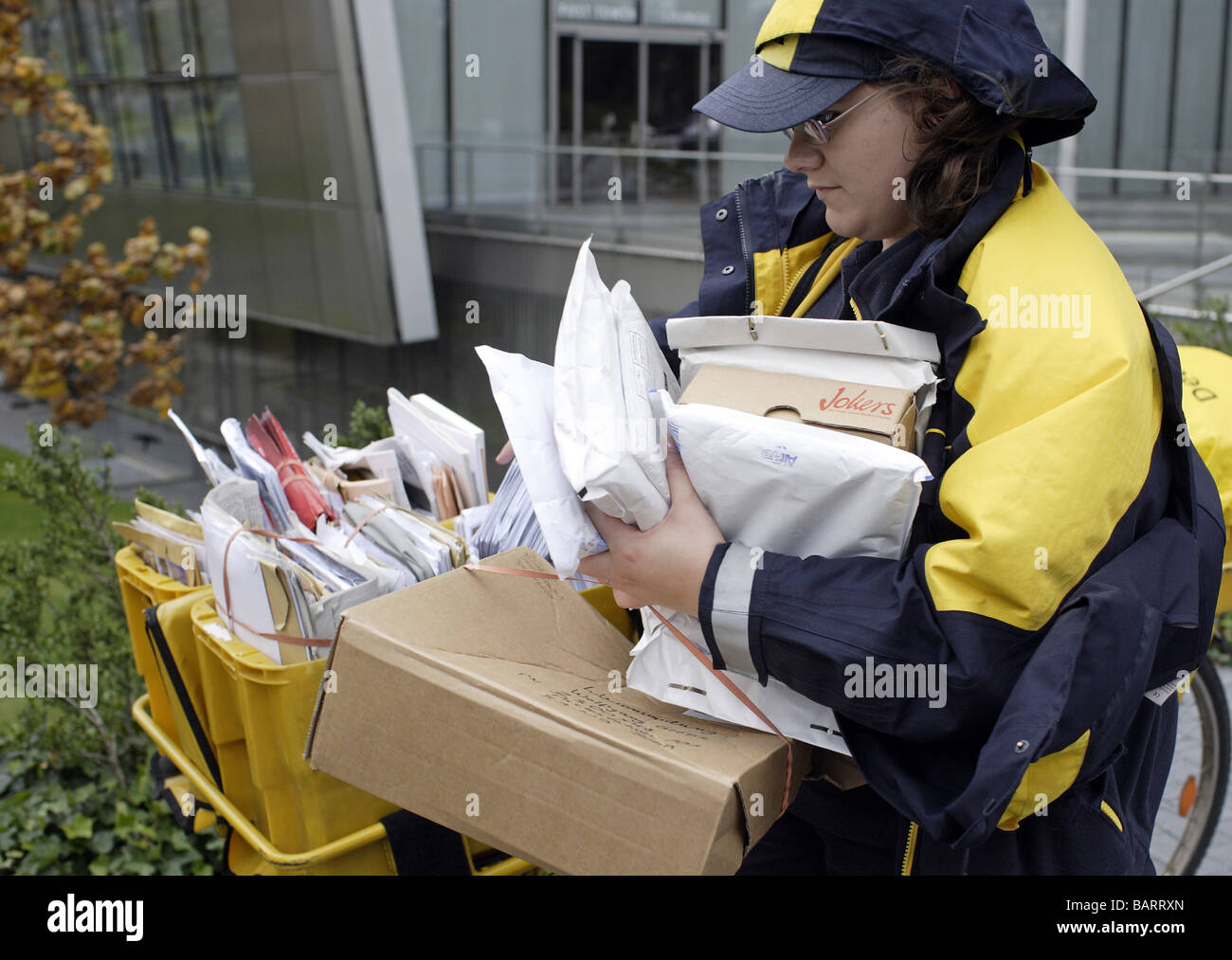 Mail carrier of Deutsche Post AG Bonn Stock Photo