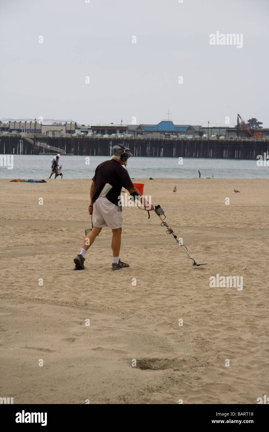 Man with metal detector on beach Stock Photo Alamy