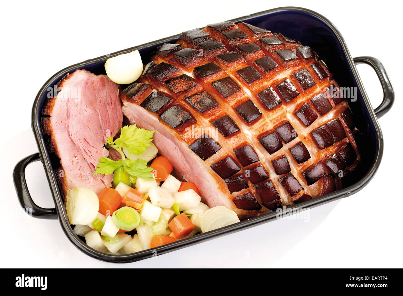 Roast Pork with Crackling in roasting tin Stock Photo Alamy