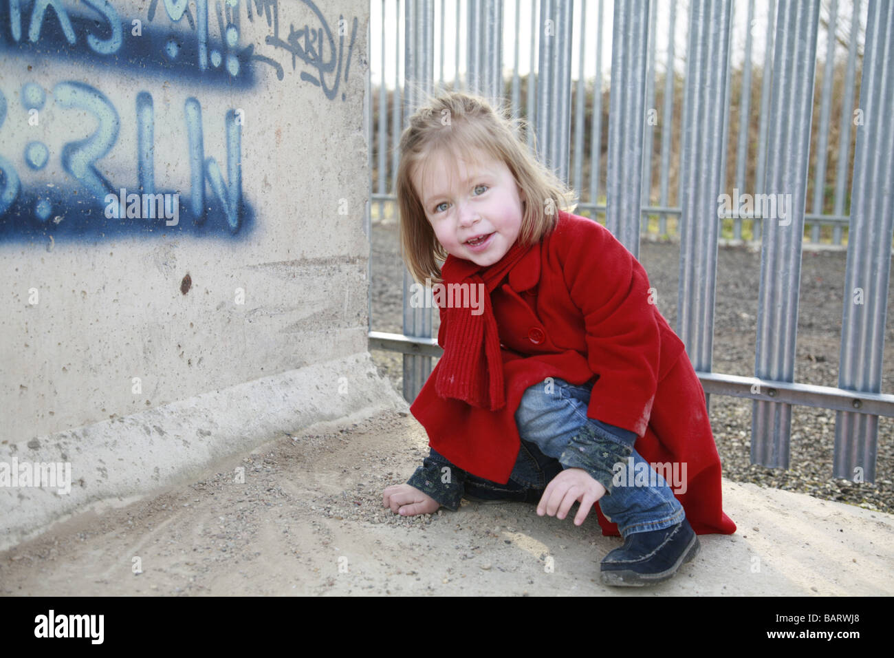 Little girl kneeling down hires stock photography and images Alamy