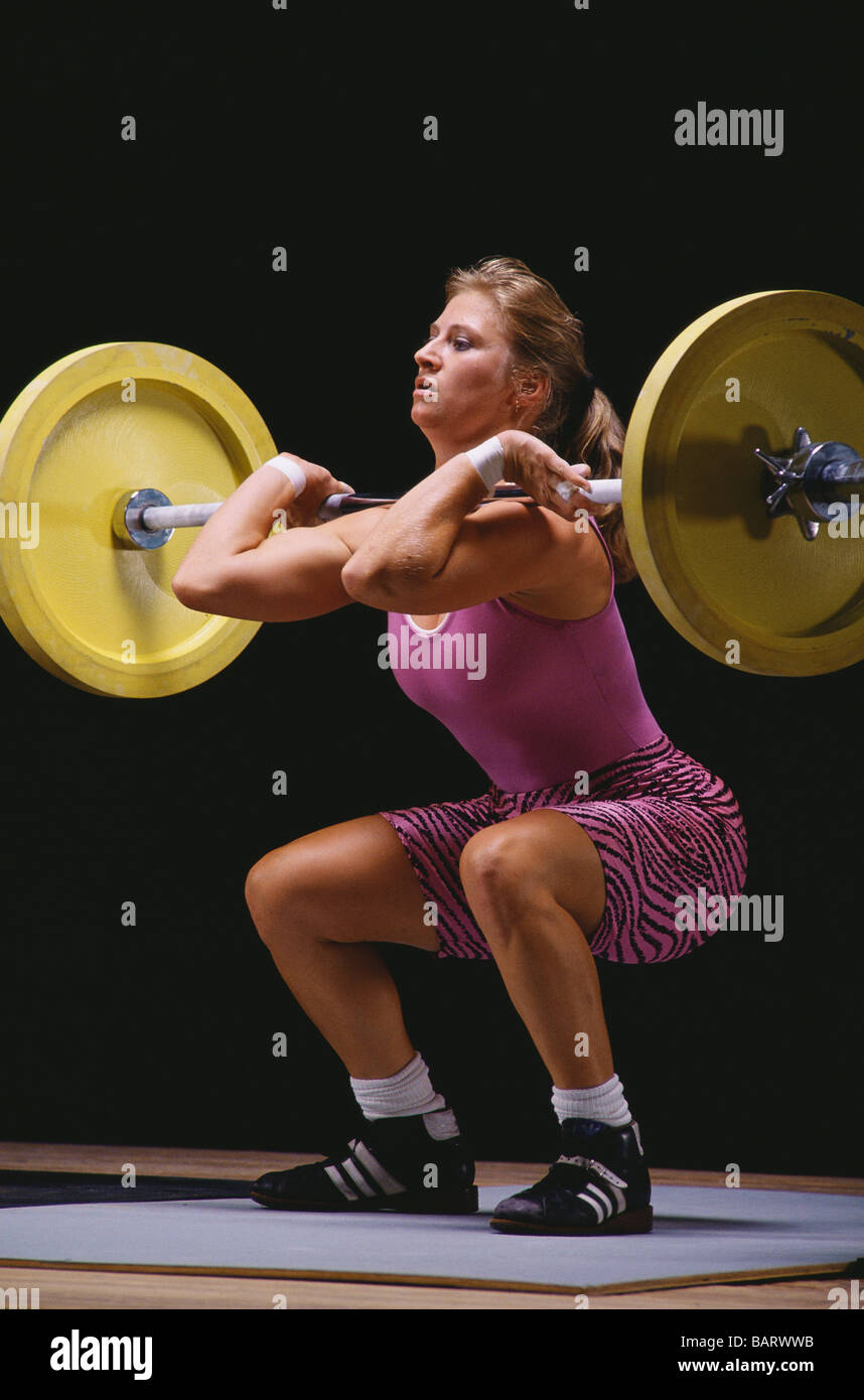 Female Olympic style weightlifter in action Stock Photo Alamy