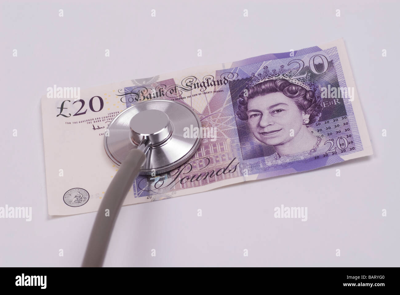 Stethoscope on British money Stock Photo Alamy