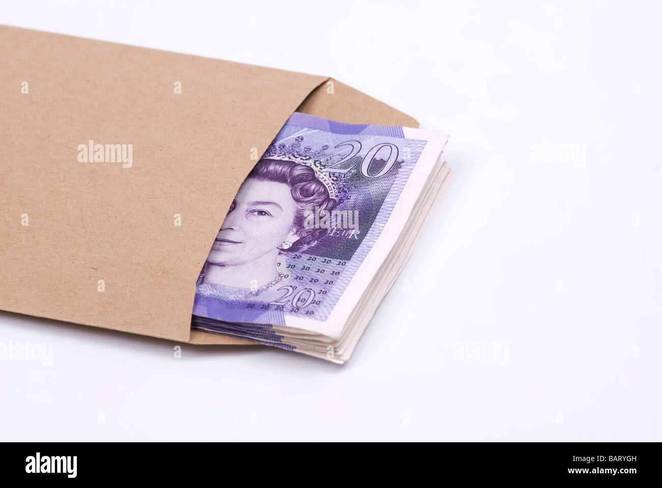 Stack of British money inside a brown envelope against a white background Stock Photo