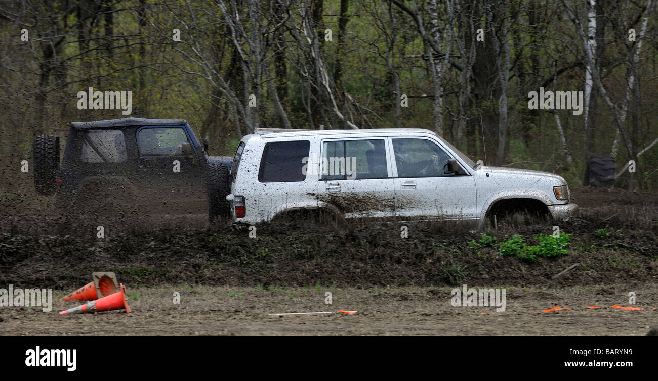 Jeep trucks competing in mud racing at Vermonster Mud Bog Stock Photo