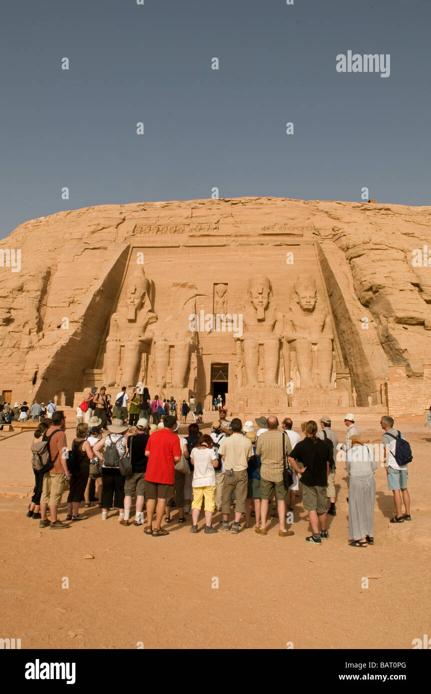 Tourists packed in front of the Sun Temple Of Ramses II in Abu Simbel rock temples. Southern Egypt Stock Photo