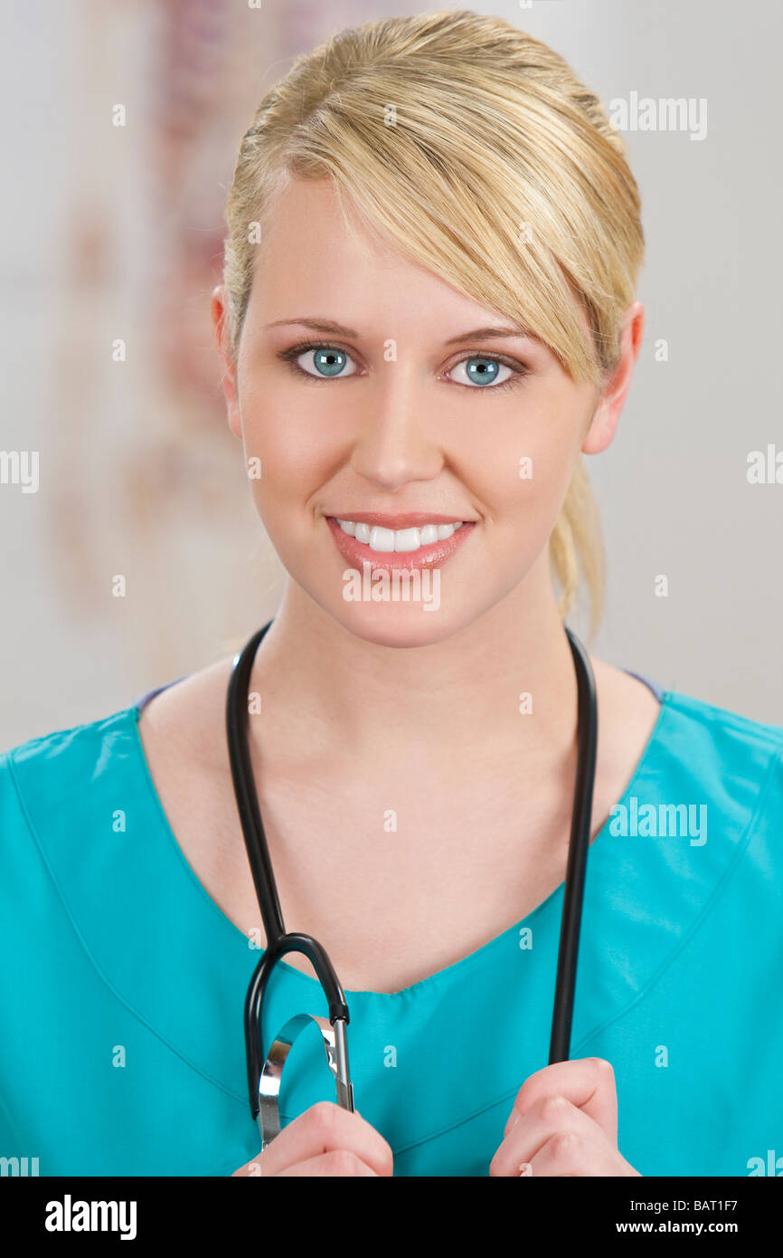 A beautiful female doctor in surgical scrubs shot in a hospital with