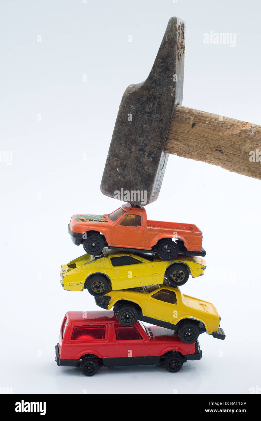 the destruction of model cars with a hammer Stock Photo