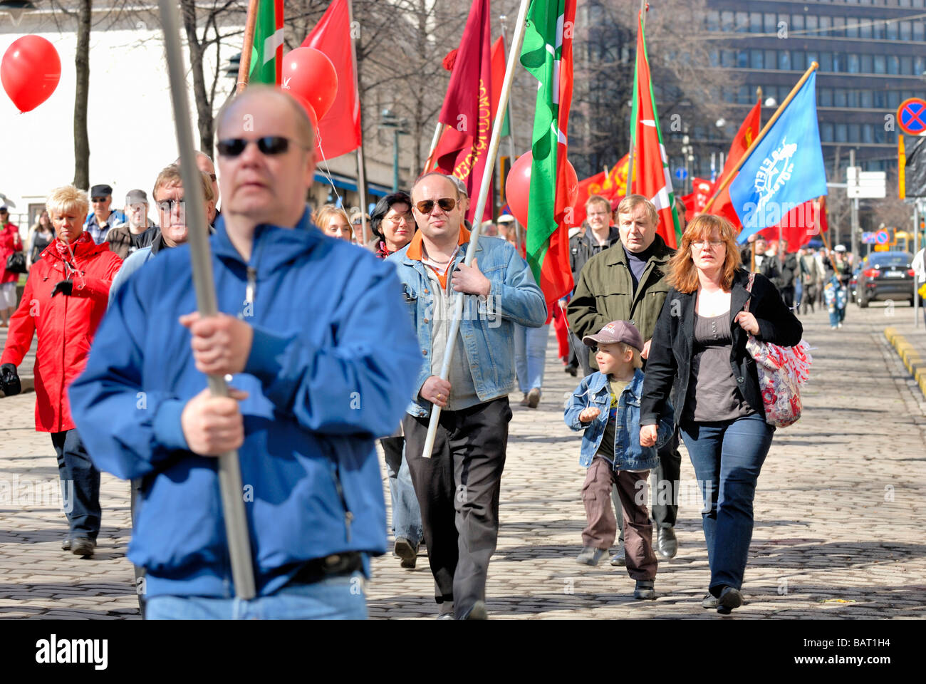 The Finnish labour union, SAK, May Day parade with the red union flag at the Esplanade. Helsinki, Finland, Scandinavia, Europe. Stock Photo