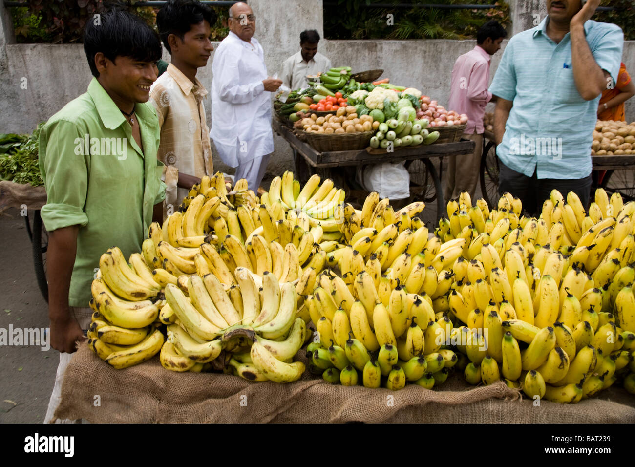 Street market seller with his top quality fresh bananas. Street market stall, Surat, Gujarat. India. Stock Photo