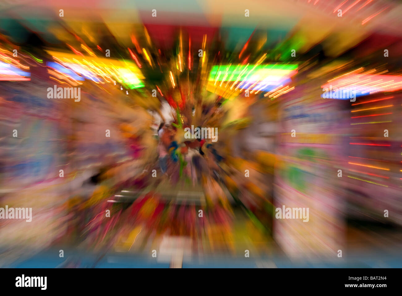 Slow shutter speed zoom burst effect at fairground Stock Photo Alamy
