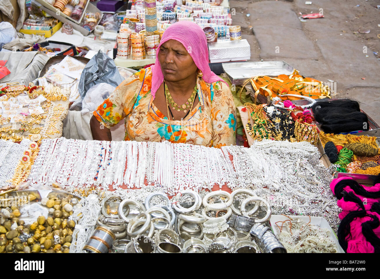 Woman selling inexpensive jewellery in Sardar Market, Jodhpur, Rajasthan, India Stock Photo