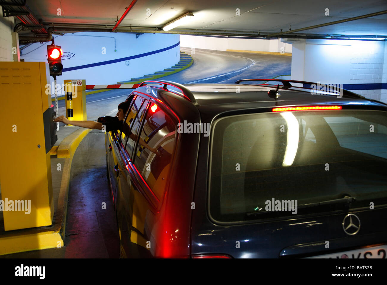 woman leaves a car park Stock Photo
