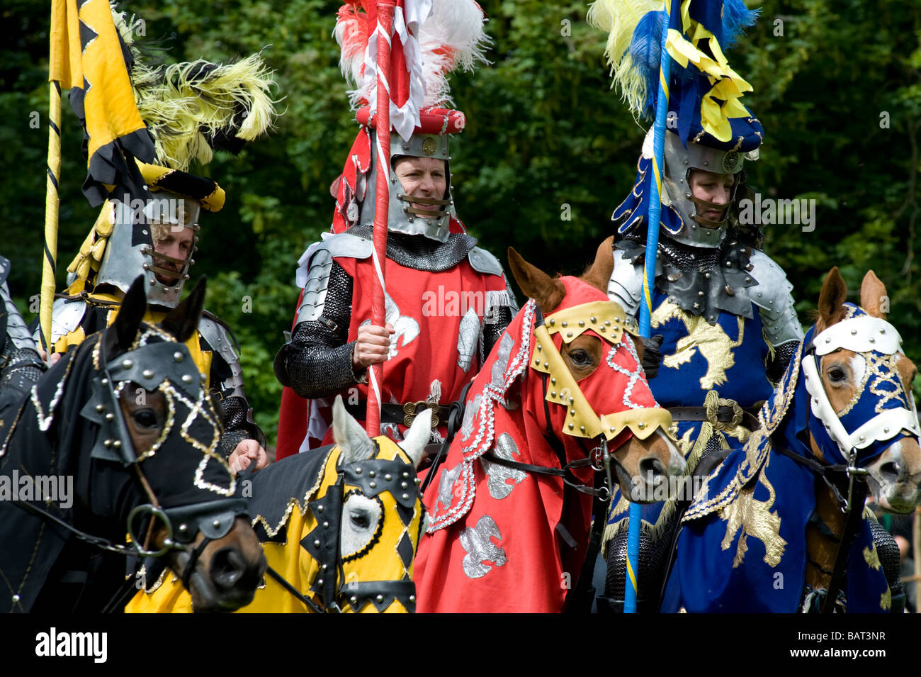 Medieval knights parade prior to battle in Jousting Tournament at Hedingham Castle, Essex, UK Stock Photo