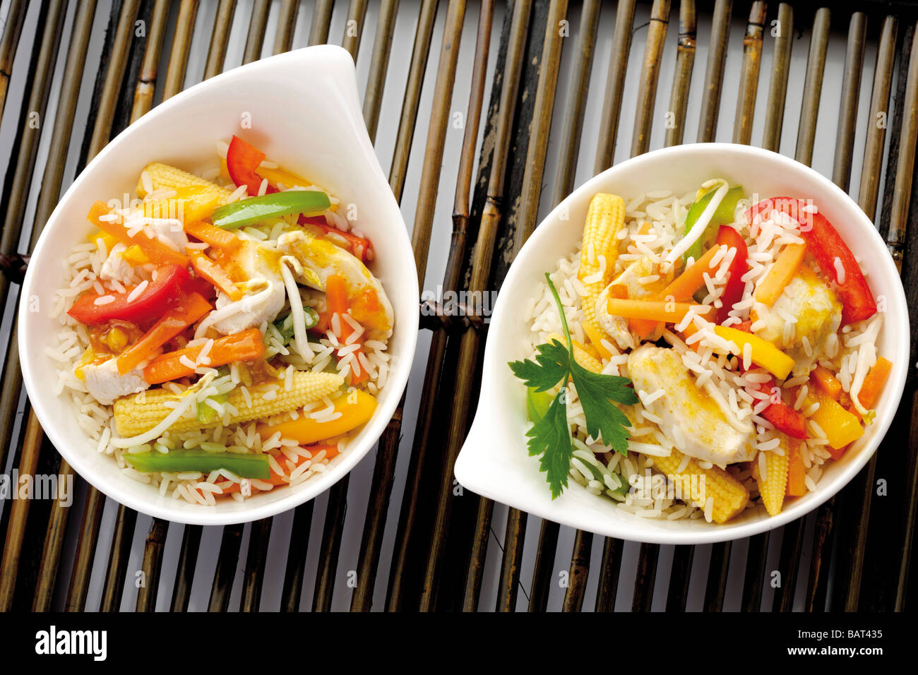 Asian dish with chicken, different vegetable and rice, elevated view