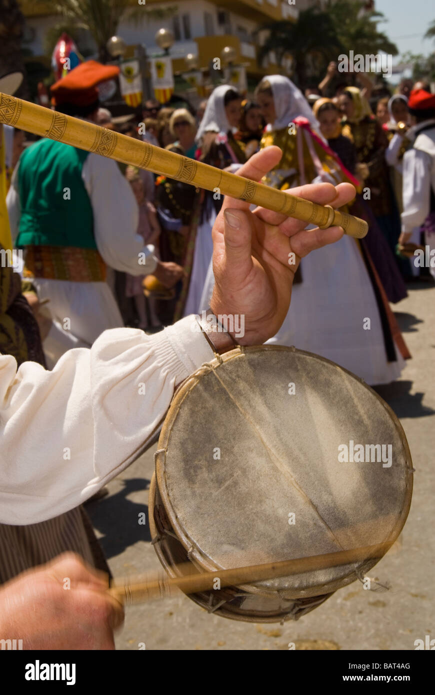 Hands detail of a flute and drum player, member of a Folklore dance