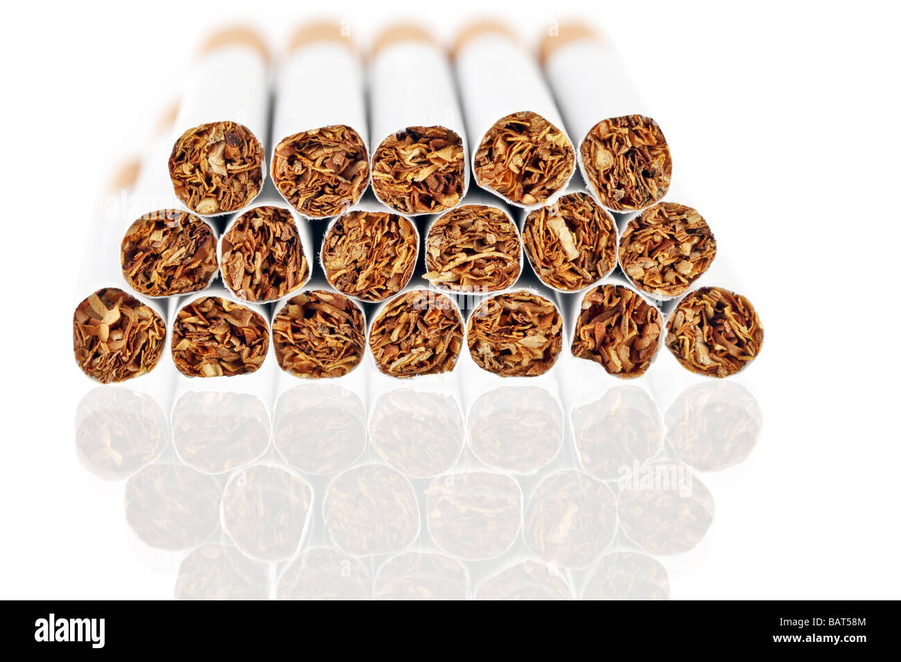 Cigarettes grouped on a reflective surface Stock Photo