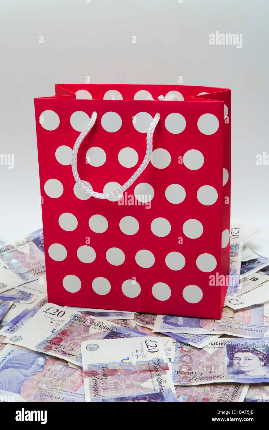 Shopping bag of a pile of British money Stock Photo