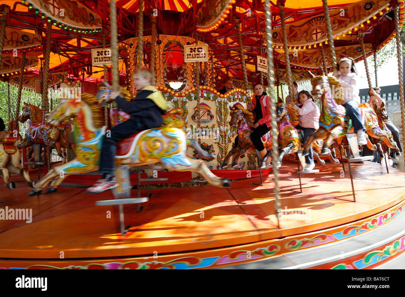 Old fashioned merry go round fair ride Stock Photo