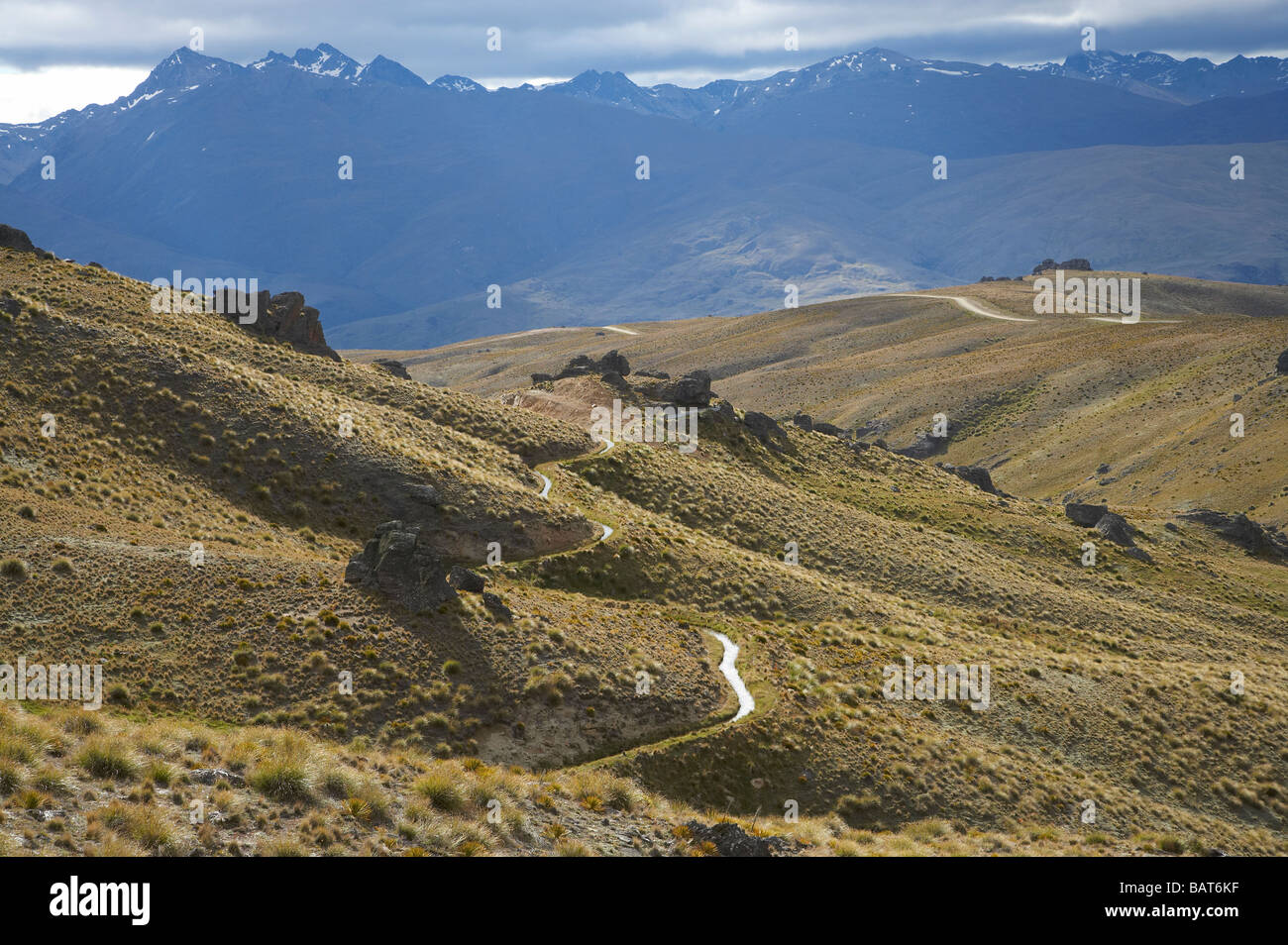 Historic Water race and Nevis Road Carrick Range looking towards Nevis Valley and Hector Mountains Central Otago New Zealand Stock Photo