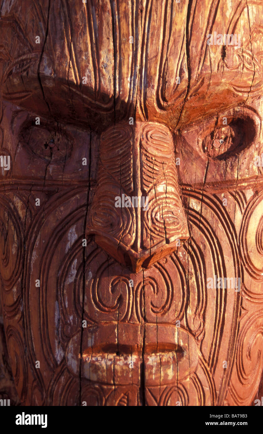 traditional Maori moko tattoo wood art carving of face head Whakarewarewa Rotorua North Island New Zealand Oceania Stock Photo