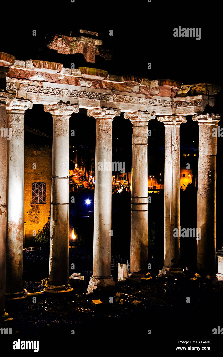 night view of the temple of Saturn in the forum of Rome in Italy Stock Photo