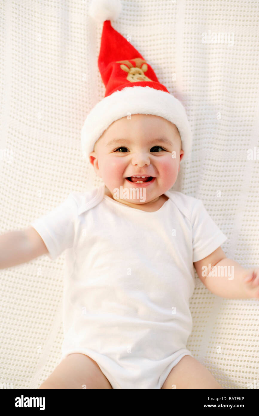 Baby boy. Nine month old boy wearing a Christmas hat Stock Photo Alamy