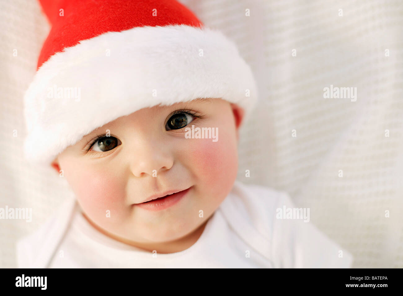 Baby boy. Nine month old boy wearing a Christmas hat Stock Photo Alamy