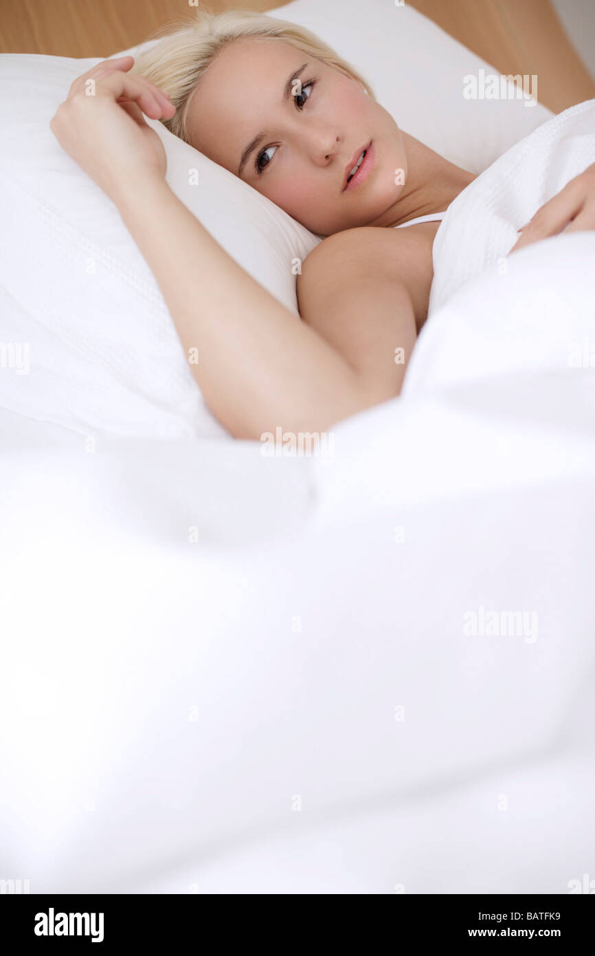 Woman in bed. Stock Photo