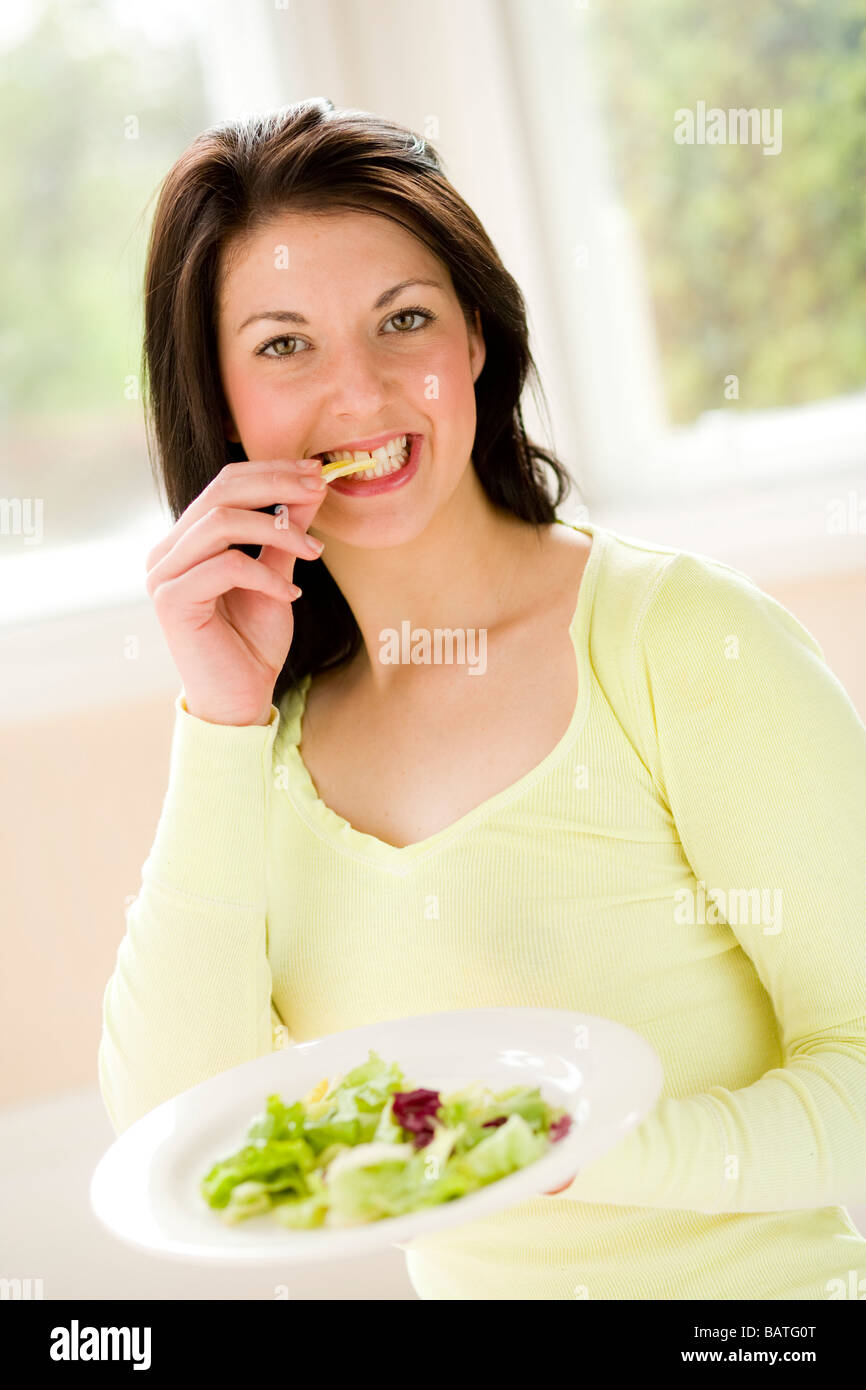 Girl eating salad Stock Photo