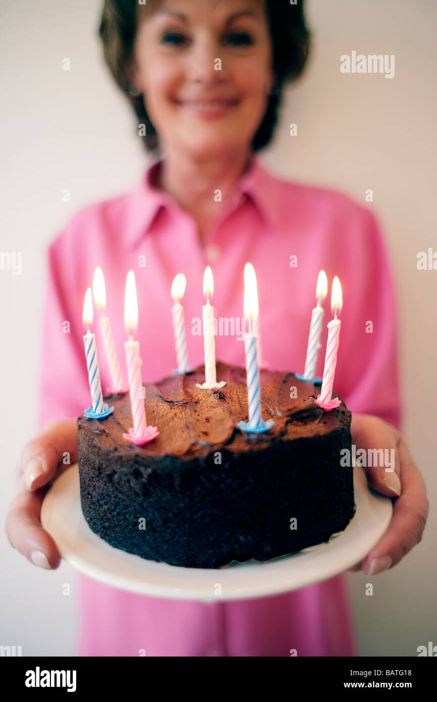 Woman carrying birthday cake hires stock photography and images Alamy